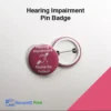 Pink hearing impairment awareness pin badge with hearing loop symbol and Please Be Patient message.